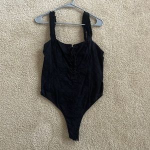 Black Free Prople smocked bodysuit. Size large. User good condition.